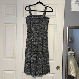 This is a black and white Talbots dress with straps. Never worn still has tags.